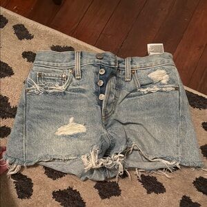 Levi's Blue Jean Shorts with Distressing and Raw Hem
